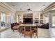 Open-concept living space with a dining area, fireplace, and sliding glass doors at 205 Red Rock Rd, Boulder City, NV 89005