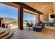 Outdoor space with a built-in grill, a bar, comfortable seating and a pool with mountain views at 205 Red Rock Rd, Boulder City, NV 89005