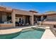 Backyard with a pool, jacuzzi, built-in grill, outdoor kitchen and covered patio at 205 Red Rock Rd, Boulder City, NV 89005