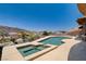 An elevated pool and jacuzzi area featuring panoramic mountain views and wrought iron fencing at 205 Red Rock Rd, Boulder City, NV 89005