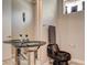 Modern powder room with a vessel sink, black toilet, and sleek design at 205 Red Rock Rd, Boulder City, NV 89005