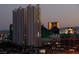 City view showcasing several hotel casinos with bright lights at twilight at 211 E Flamingo Rd # 1617, Las Vegas, NV 89169