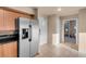 Contemporary kitchen with stainless steel refrigerator and tiled floors at 211 E Flamingo Rd # 1617, Las Vegas, NV 89169