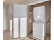 Efficient laundry closet with a stackable washer and dryer, and an ironing board for your convenience at 211 E Flamingo Rd # 1617, Las Vegas, NV 89169