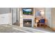 Inviting living room featuring a cozy fireplace, television, and comfortable workspace at 211 E Flamingo Rd # 1617, Las Vegas, NV 89169