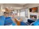 Bright living room featuring modern furnishings, a fireplace and an adjacent kitchen at 211 E Flamingo Rd # 1617, Las Vegas, NV 89169