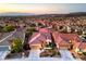 Expansive aerial view of the home nestled in a vibrant neighborhood with mountain views at 2144 Marywood Park Ct, Henderson, NV 89044