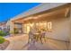 Enjoy this outside patio with a great view with an outdoor dining set at 2144 Marywood Park Ct, Henderson, NV 89044