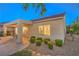 Spacious backyard includes a covered patio with desert landscaping and mature trees at 2144 Marywood Park Ct, Henderson, NV 89044