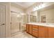 Bathroom features a glass shower, double vanity sinks, and tile flooring at 2144 Marywood Park Ct, Henderson, NV 89044