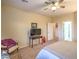 Bedroom with ceiling fan, TV, and door to bathroom at 2144 Marywood Park Ct, Henderson, NV 89044