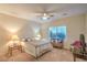 Primary bedroom features a ceiling fan, comfortable furnishings, and natural light at 2144 Marywood Park Ct, Henderson, NV 89044