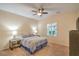Relax in this bedroom with a ceiling fan and neutral tones with natural light at 2144 Marywood Park Ct, Henderson, NV 89044