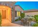 Inviting front entrance with stone archway and outdoor seating area at 2144 Marywood Park Ct, Henderson, NV 89044