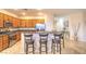 Kitchen features wood cabinets, granite countertops, stainless steel appliances, and a breakfast bar with seating at 2144 Marywood Park Ct, Henderson, NV 89044
