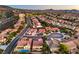 Aerial view displays a neighborhood with lush landscaping, community planning and scenic backdrop at 2144 Marywood Park Ct, Henderson, NV 89044