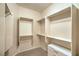 This walk-in closet has shelving with white cabinets and a small amount of carpet at 2144 Marywood Park Ct, Henderson, NV 89044