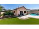 Beautiful backyard features a lawn area, patio, and planter with direct access to the home at 2200 Valley Heights Ave, Henderson, NV 89052