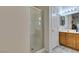 Bathroom features a glass-enclosed shower and a vanity with storage and countertop space at 2200 Valley Heights Ave, Henderson, NV 89052