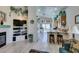 Open-concept living room flows into the kitchen featuring a breakfast bar and modern appliances at 2200 Valley Heights Ave, Henderson, NV 89052