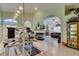Open-concept living area with fireplace, parquet flooring, and view to kitchen and entry at 2200 Valley Heights Ave, Henderson, NV 89052