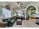 Cozy living room with wood floors, a fireplace, and arched entryways perfect for relaxing and entertaining at 2200 Valley Heights Ave, Henderson, NV 89052