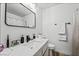 Stylish bathroom with a sleek vanity, white marble countertop, and modern fixtures at 2507 Albemarle Way, Henderson, NV 89014