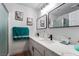 Modern bathroom with double sinks, large mirrors, and glass-enclosed shower at 2507 Albemarle Way, Henderson, NV 89014