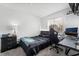 Cozy bedroom with a modern black theme and a functional workspace at 2507 Albemarle Way, Henderson, NV 89014