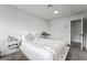 Well-lit bedroom featuring neutral colors, carpet, and minimalist decor at 2507 Albemarle Way, Henderson, NV 89014