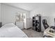 Bright bedroom with neutral tones, a large window, and workspace area at 2507 Albemarle Way, Henderson, NV 89014