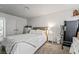 Comfortable bedroom with bed, nightstand, dresser, and a small workout machine at 2507 Albemarle Way, Henderson, NV 89014