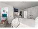 Bright primary bedroom with dresser, TV, attached bathroom and closet access at 2507 Albemarle Way, Henderson, NV 89014