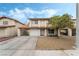 Charming two-story home with a tile roof, a two-car garage, and desert landscaping at 2507 Albemarle Way, Henderson, NV 89014