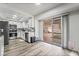 Bright kitchen featuring white cabinets, stainless steel appliances, and backyard access at 2507 Albemarle Way, Henderson, NV 89014
