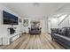 Bright and airy living area featuring modern furnishings, wood-look flooring, and lots of natural light at 2507 Albemarle Way, Henderson, NV 89014