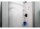 Tiled shower stall featuring adjustable shower head and a sleek, modern design at 2507 Albemarle Way, Henderson, NV 89014