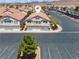 Aerial view of home showing roof, parking, desert landscaping, and quiet community at 2596 Lazy Saddle Dr, Henderson, NV 89002
