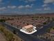 Aerial view showcases a charming neighborhood with well-maintained homes and mountain views at 2596 Lazy Saddle Dr, Henderson, NV 89002