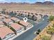 Planned community featuring well-maintained homes, desert landscape, and mountain views at 2596 Lazy Saddle Dr, Henderson, NV 89002
