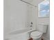 Clean bathroom with shower-tub combo and natural light from window at 2596 Lazy Saddle Dr, Henderson, NV 89002