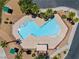 Aerial view of a community pool with a unique shape and multiple entry points and a gazebo at 2596 Lazy Saddle Dr, Henderson, NV 89002