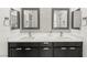 Bathroom features a dual sink vanity with modern fixtures and large framed mirrors at 295 Callen Falls Ave # 2225, Henderson, NV 89011