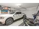 Spacious garage featuring a white truck, exercise equipment, and plenty of storage space at 295 Callen Falls Ave # 2225, Henderson, NV 89011