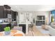 Stylish kitchen featuring black cabinets, a white island, stainless steel appliances, and open layout at 295 Callen Falls Ave # 2225, Henderson, NV 89011