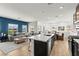 Open-concept kitchen with a large island, stainless steel appliances, and seamless flow into the living area at 295 Callen Falls Ave # 2225, Henderson, NV 89011