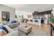 Enjoy the open floor plan, as the living room flows into the dining area and kitchen with modern finishes at 295 Callen Falls Ave # 2225, Henderson, NV 89011
