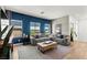 This living room features a plush sectional sofa, neighborhood views, and a modern design that is ideal for relaxation at 295 Callen Falls Ave # 2225, Henderson, NV 89011