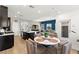 Open concept living space with a dining area, kitchen island and comfortable seating, perfect for entertaining at 295 Callen Falls Ave # 2225, Henderson, NV 89011