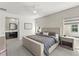 Inviting primary bedroom with a neutral color palette, a comfortable bed, and an attached bathroom at 295 Callen Falls Ave # 2225, Henderson, NV 89011